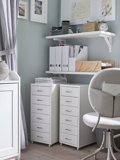 White filing cabinet, 5 drawers, mobile with casters.