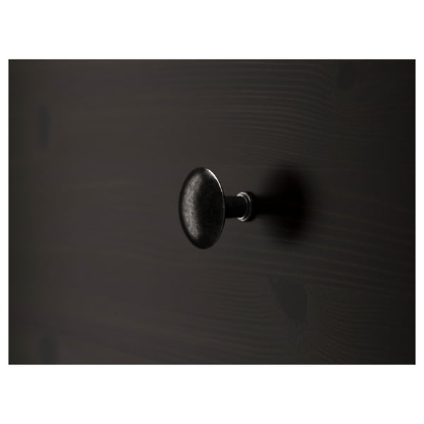 A sleek black wooden drawer handle, smoothly attached to a sturdy wooden chest, showcasing high-quality craftsmanship and design.