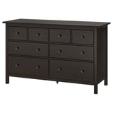 A HEMNES dark gray wooden dresser with six drawers in two rows. The design is simple and modern with round knobs.