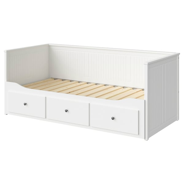White HEMNES day-bed with three drawers, wooden slatted base, vertical panel design.