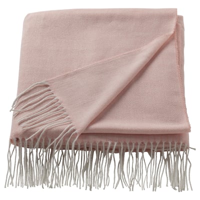 Light pink HOLMVI throw blanket, soft, rectangular with fringe edges, made from recycled polyester.