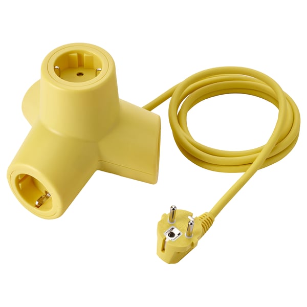 Yellow HORNFELS 4-way extension, triangular shape for multiple plugs, polycarbonate & silicone, playful design.