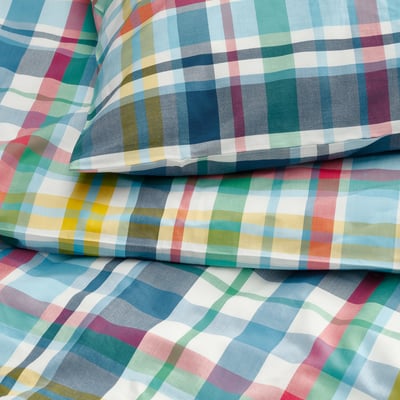 Brightly colored plaid bedding, HÖSTGENTIANA. Multi-colored checkered pattern on folded duvet and pillows. Soft cotton-viscose blend.