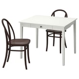 White square dining table with drawer, wooden chairs, classic bentwood design.