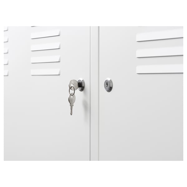White cabinet with slanted shelves, one unlocked with keys, secure design.