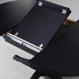 Black tables self-storing leaf extends seating.