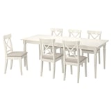 A white INGATORP dining set with an extendable table and six chairs, featuring upholstered seats.
