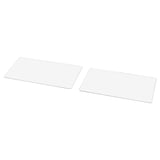 Two transparent glass plates, rectangular, with a grid design, lie flat side by side.