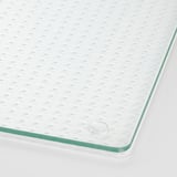Green-edged glass cover with textured surface and vent.