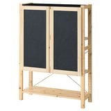 IVAR storage unit in natural pine with two dark grey felt doors and shelves. Simple, sturdy, and versatile design.