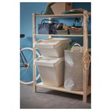 IVAR storage unit with 3 shelves: bags, plant, cleaning supplies, bins, laundry bag.