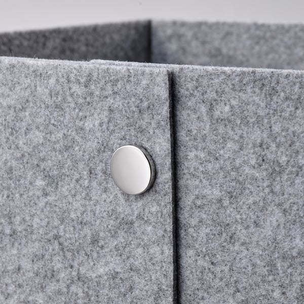 Metal button on grey box