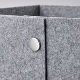 Metal button on grey box