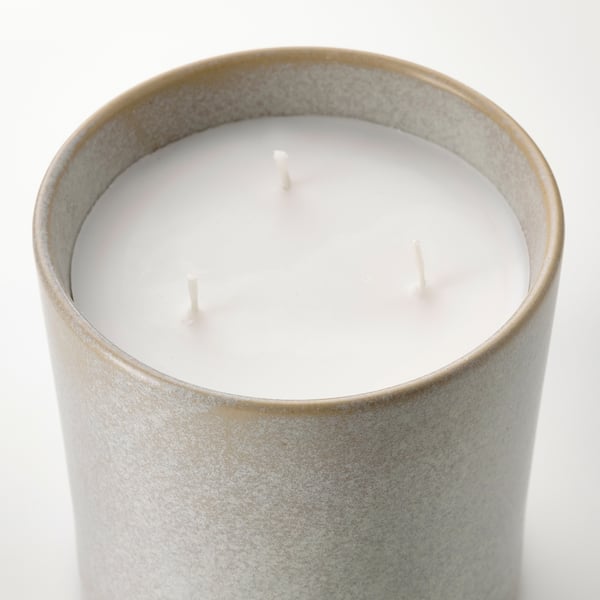Cylindrical scented candle in textured metallic jar with three wicks, unlit. Elegant and sophisticated design, high-quality appearance.