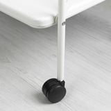 Close-up of sturdy metal table leg with black castor wheel, showcasing quality and mobility.