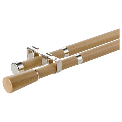 The KÄGELKAKTUS double curtain rod set with oak finish and nickel accents. It includes connectors for versatile configurations.
