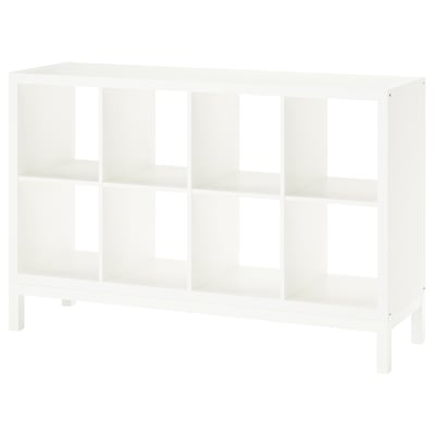 A white KALLAX shelving unit with open cubes and an airy underframe design.