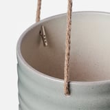 Modern hanging planter with jute rope and metal hook, showcasing gray speckled finish.