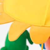 Bright yellow and orange sunflower plush toy with green stem; detail shot focusing on stitching quality.