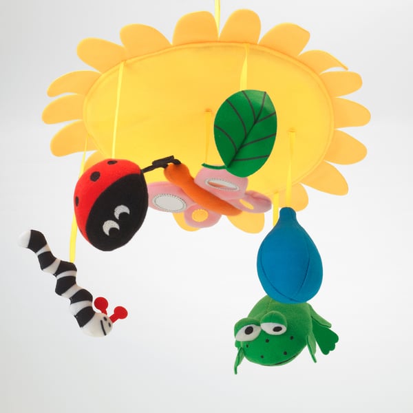 Colorful baby mobile with sun, bug, caterpillar, butterfly, and frog toys.
