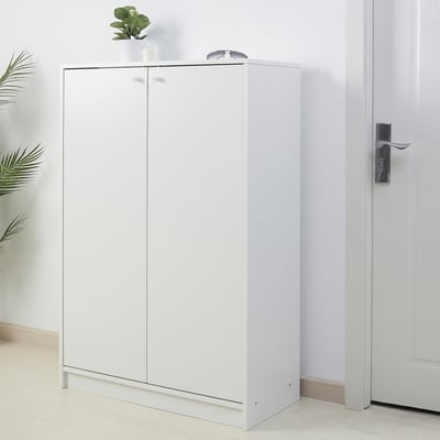 White KLEPPSTAD shoe cabinet in hallway, tall, sleek, organized.