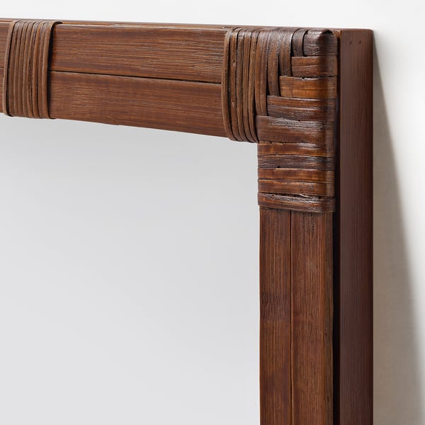 Bamboo mirror frame on wall
