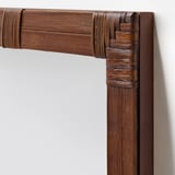 Bamboo mirror frame on wall