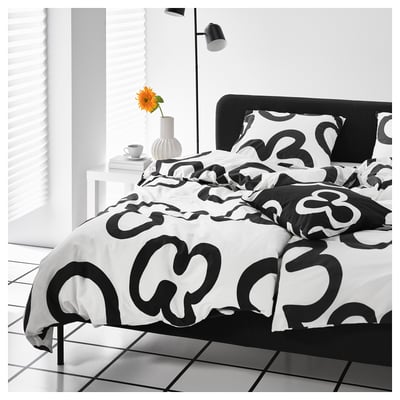 The black and white klippbracka duvet cover, folded neatly. The design is abstract with bold, contrasting patterns.