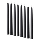 Eight black KLOKHET candles, slim, cylindrical shape, made of stearin.