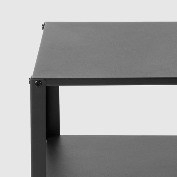 Modern black side table with metal frame, visible screws, and two shelves.