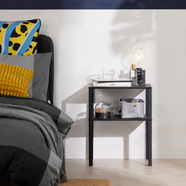 KNARREVIK: modern black side table with shelf for small spaces. Holds coffee mugs, books, and decor. Compact size, easy assembly.
