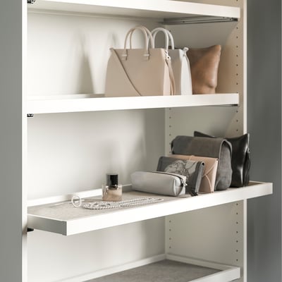 Closet shelf with handbags and jewelry. Or for a more concise version: closet shelf with bags and jewelry.