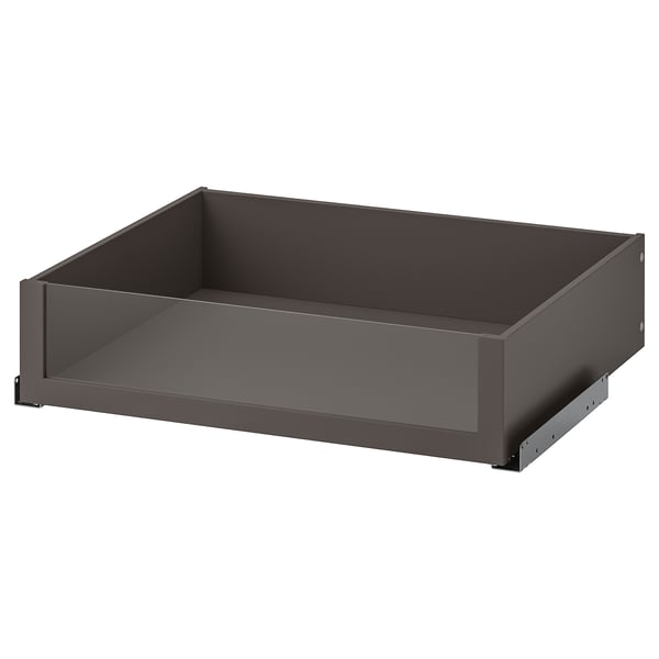 An empty, modern drawer named KOMPLEMENT in dark grey color with a sleek design. It a glass front for easy content viewing.