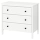 A white KOPPANG chest of drawers with three drawers and black knobs, made of fiberboard and particleboard, designed for safe wall anchorage.