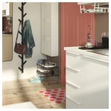 Bright red dotted mat with white dots, rubber backing, rectangular shape. Perfect for hallways, easy to clean.