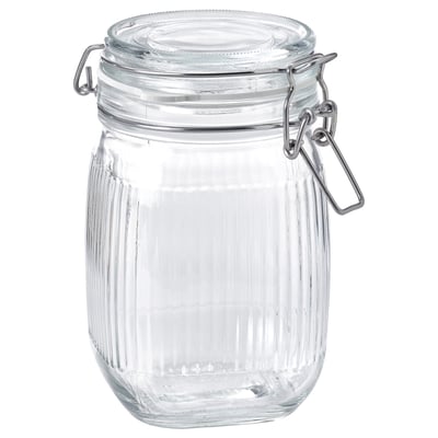 A clear KÖSSEBÄR glass jar with a ribbed design and an airtight silver metal lid.