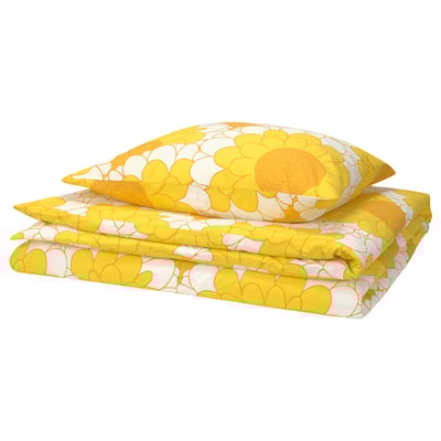 A yellow KRANSMALVA duvet cover set with sunflower designs in cotton and viscose, neatly folded.