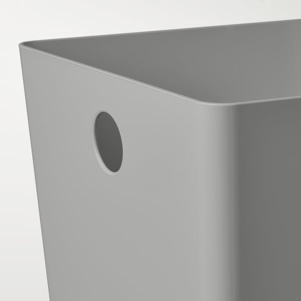 Close-up of a sleek, smooth grey plastic storage box, designed for organization.
