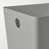 Close-up of a sleek, smooth grey plastic storage box, designed for organization.