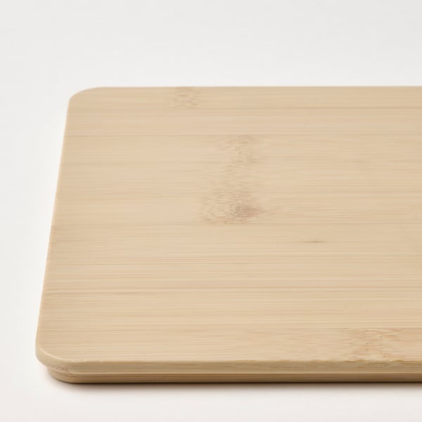 Smooth bamboo lid, slightly worn but durable, fits on KUGGIS box, natural wood texture visible.