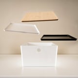 Floating storage lids and box, ideal for organizing and protecting items from dust.