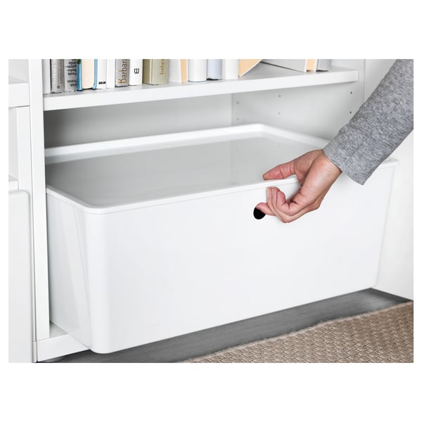 Hand placing lid on KUGGIS storage box, showcasing its dust protection feature.