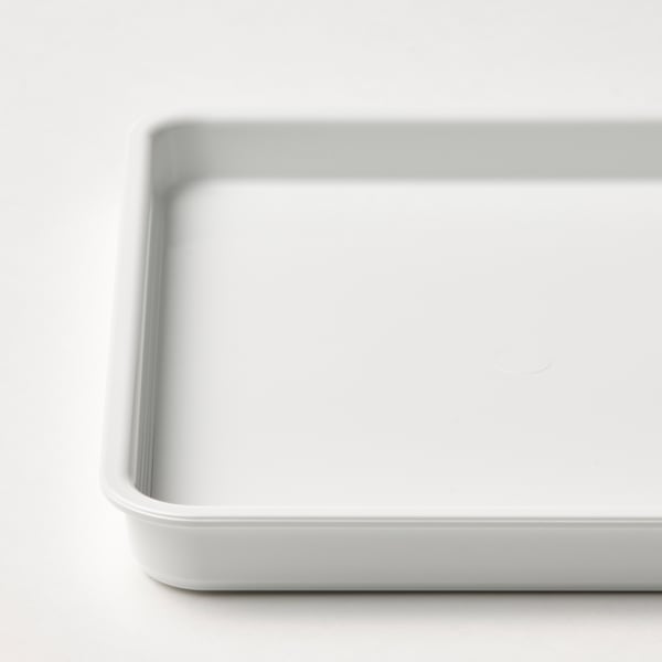 Close-up of a pristine, white plastic container with rounded edges, clean and undamaged, ideal for storage.