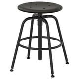 KULLABERG adjustable black stool with round seat and metal footrest.
