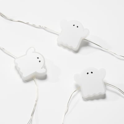 Halloween string lights: KUSTFYR, white, ghostly shapes, battery-powered, eerie design.