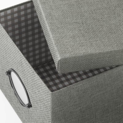 KVARNVIK grey storage box with handle and lid. Made of recycled paperboard and steel, rectangular shape with woven texture.