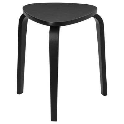 A black KYRRE stool with a triangular seat and three bent legs made of veneer and wood, designed to be stackable and stable.