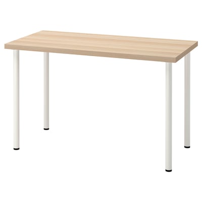 An IKEA LAGKAPTEN desk with light wood top and white metal legs. Its rectangular, modern, and minimalist, ready for easy assembly.