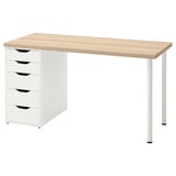 A LAGKAPTEN desk with a light wood top, white drawers, and four metal legs. It has five drawers with cut-out handles.