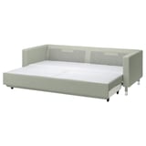 A green convertible sofa-bed with chrome legs.